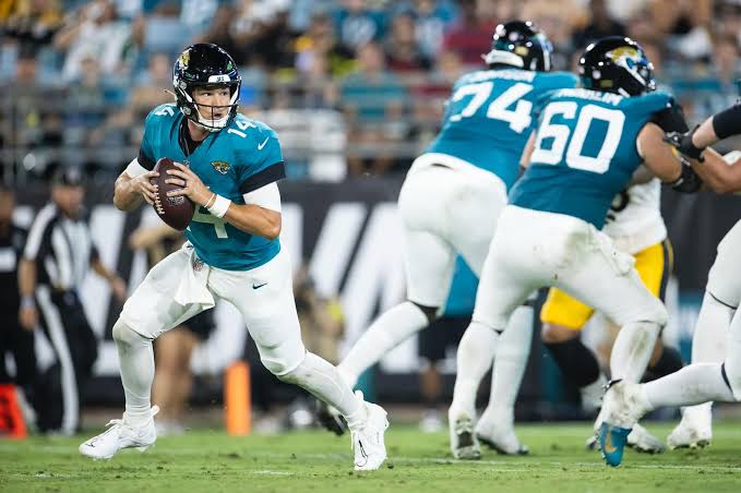 Nick Mullens dropping back in the pocket in a Jacksonville Jaguars uniform